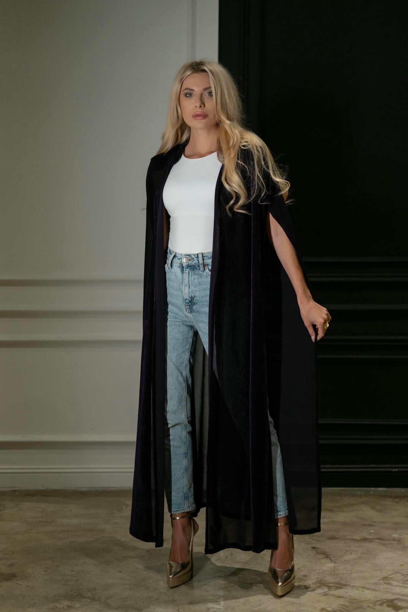 model wearing a purple cape in casual look