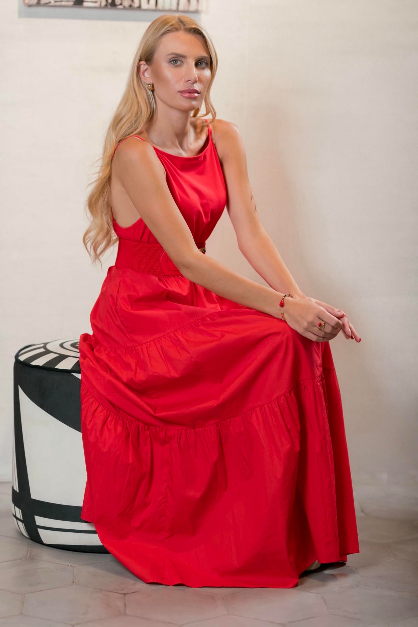 a model wearing a Tiered Red Maxi Dress