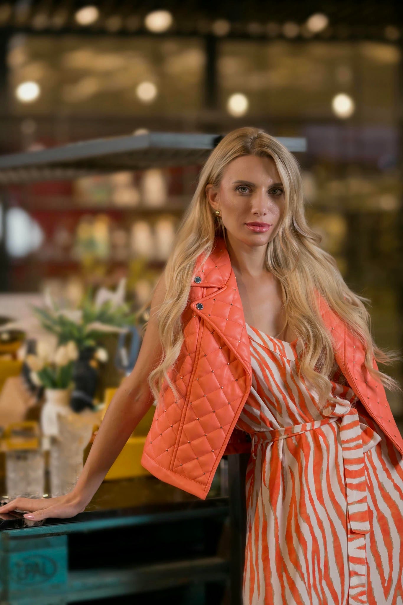model wearing an Orange and Cream Zebra Maxi Dress