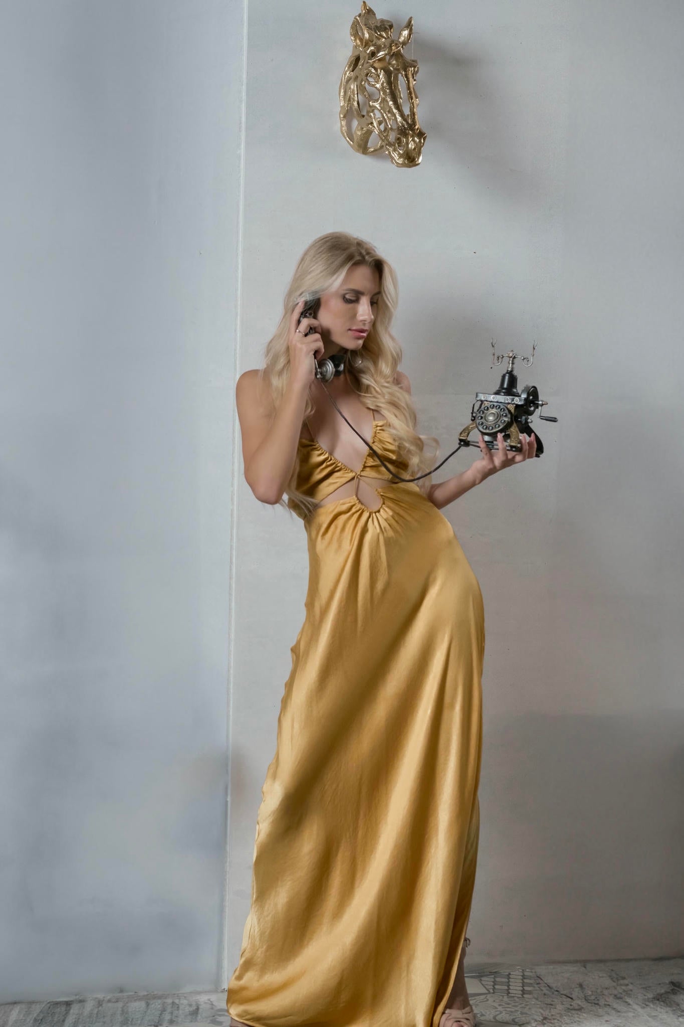 a model wearing a Satin Gown with Tie-Back in Warm Gold