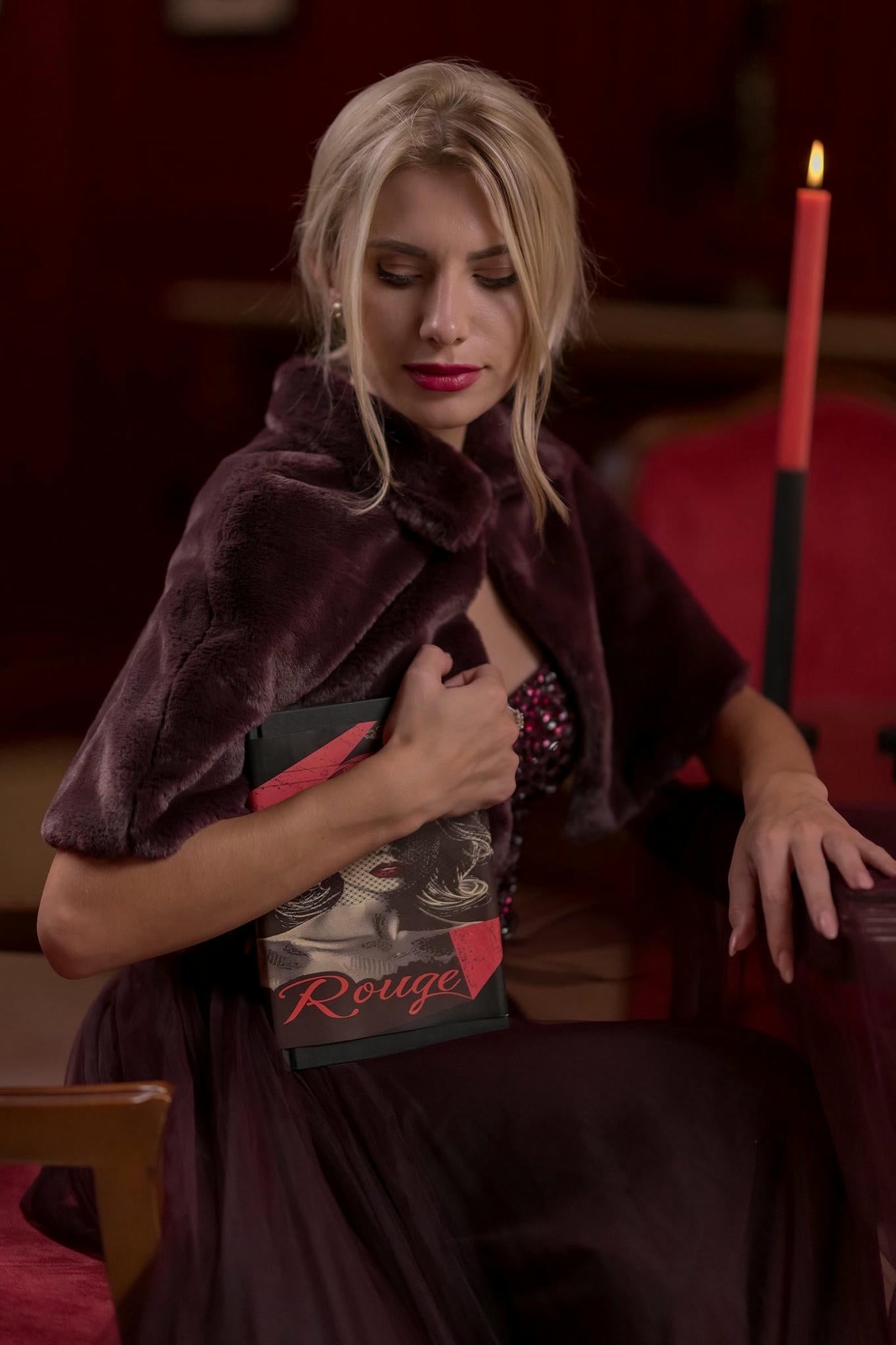 a model wearing a Plum Tulle Skirt and Corset Set with Velvet Fur Cape