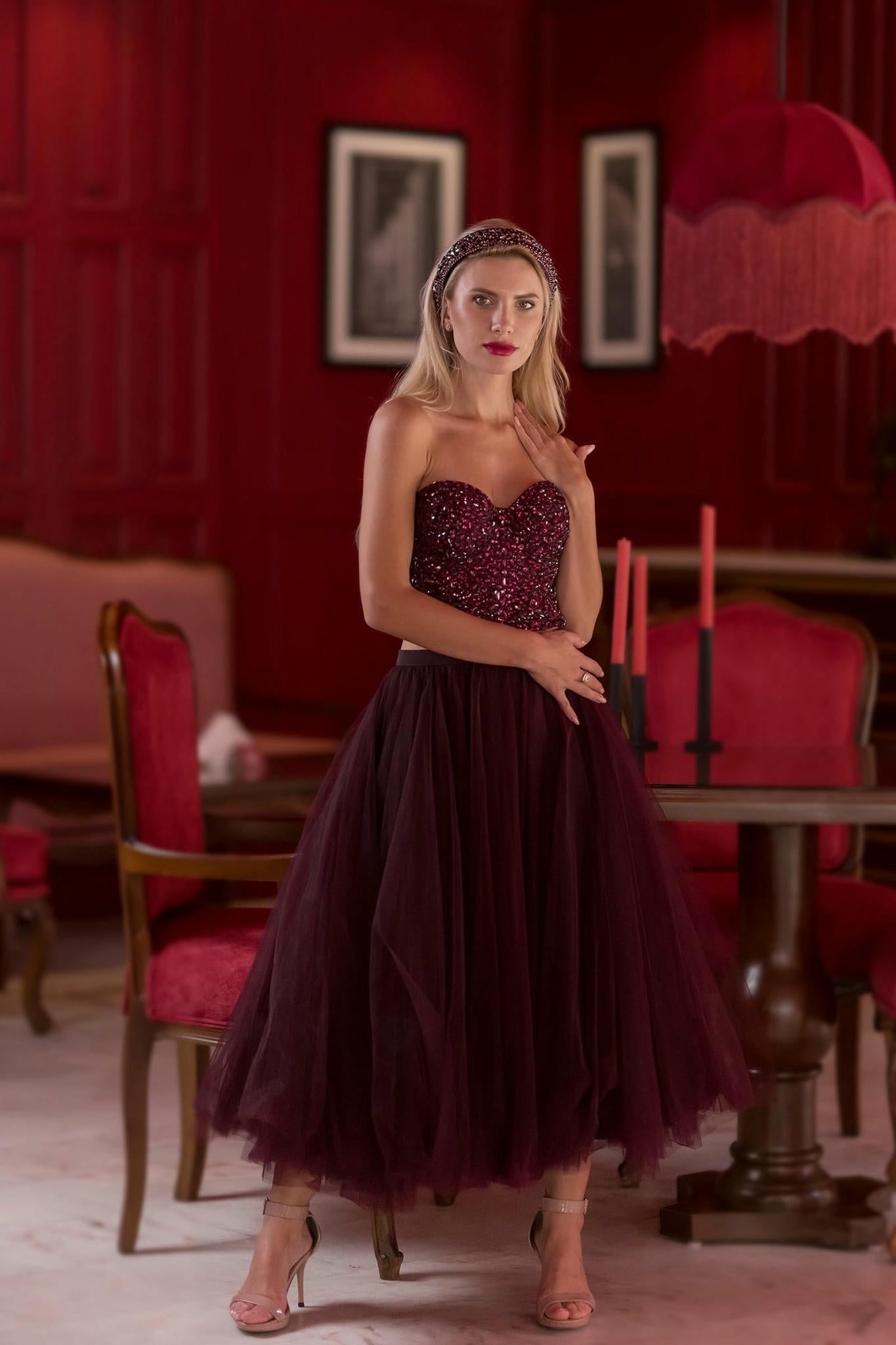 a model wearing a Plum Tulle Skirt and Corset Set with Velvet Fur Cape