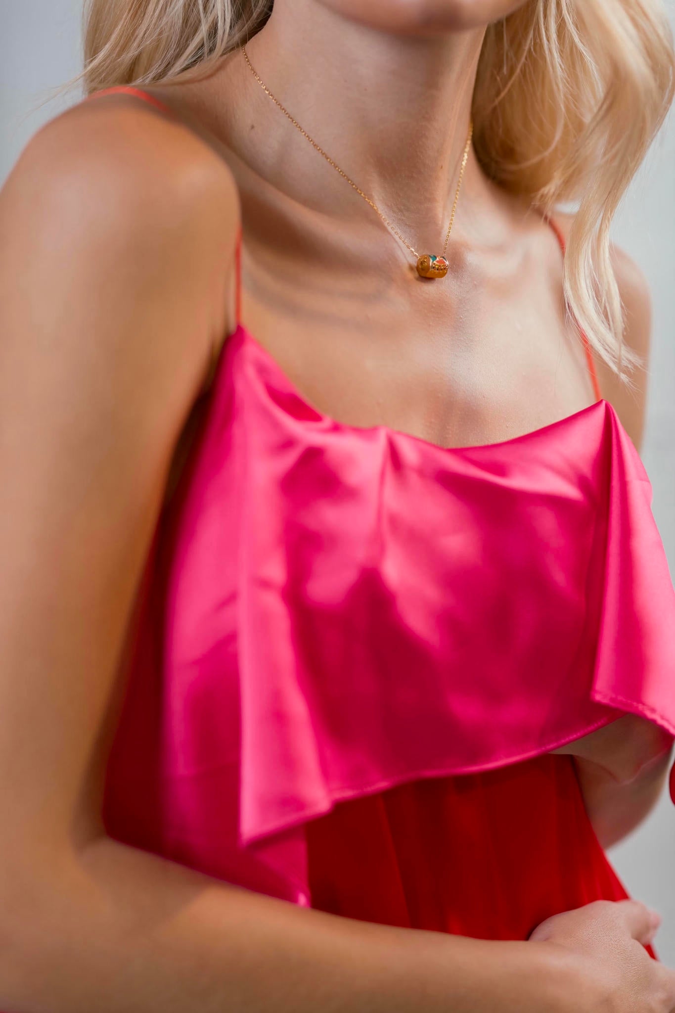 model wearing a Fuchsia and Coral Silk Gown with Ruffled Bodice