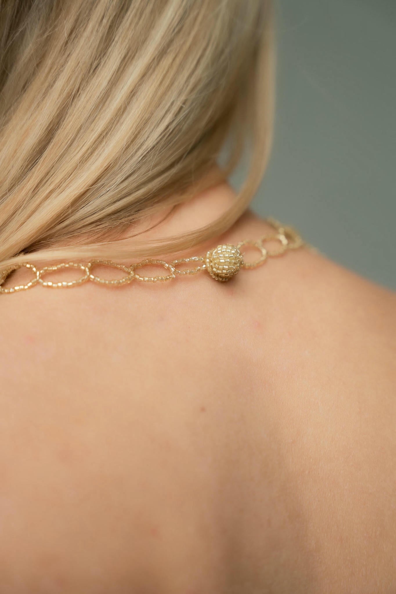 choker made of handwoven gold beads- back view - viola tresor collection