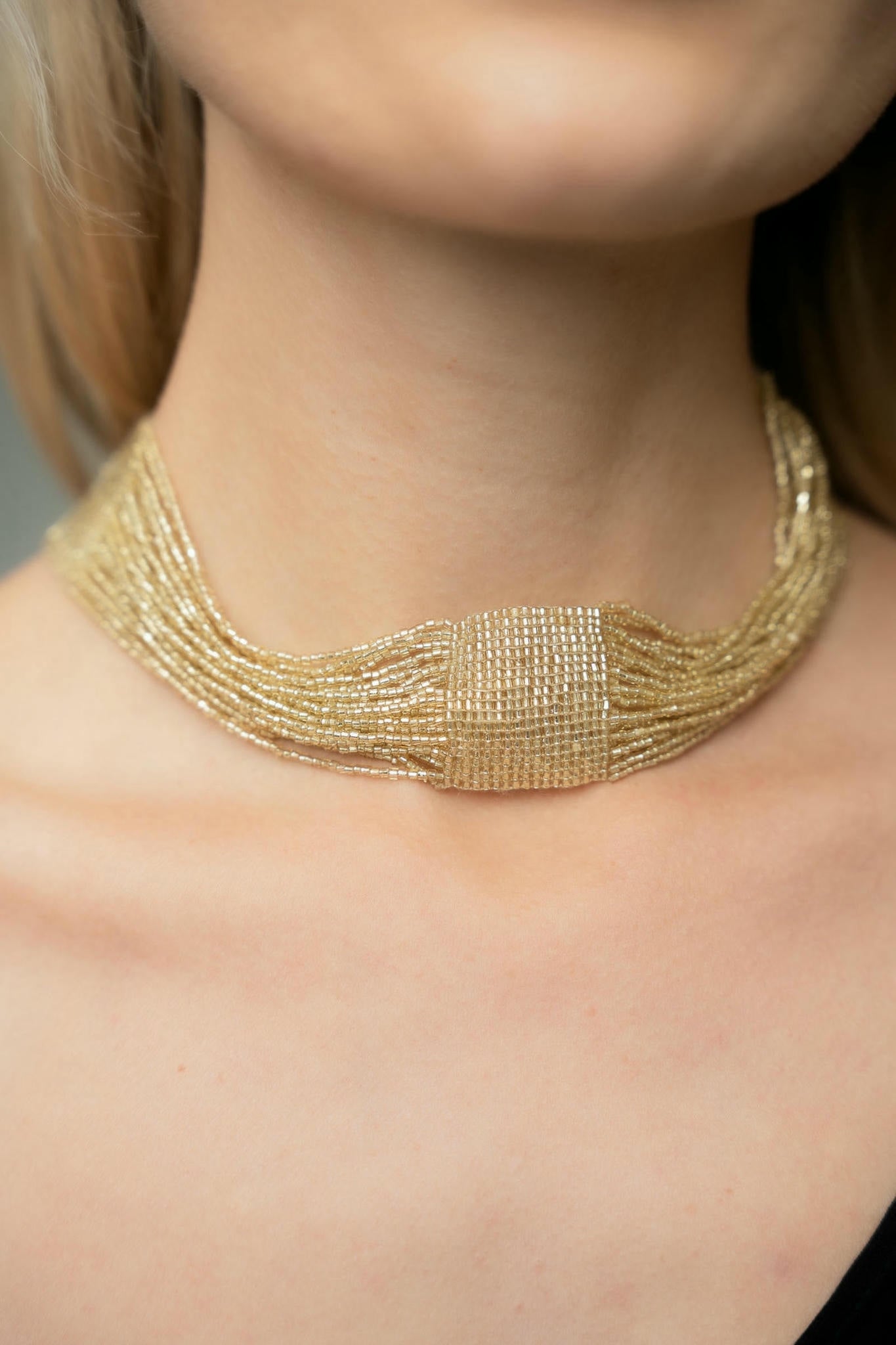 choker made of handwoven gold beads