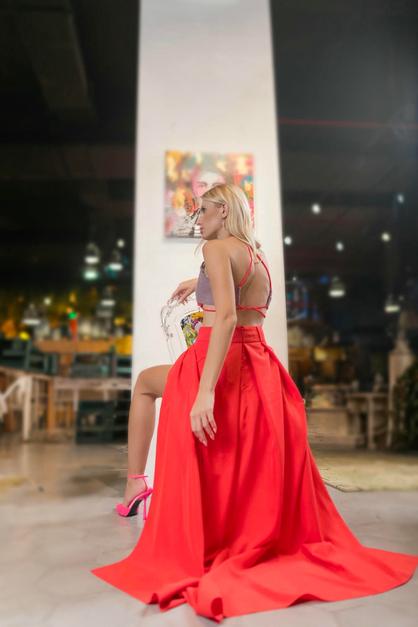 a model wearing a Red Maxi Skirt and Lilac Halter Top Set