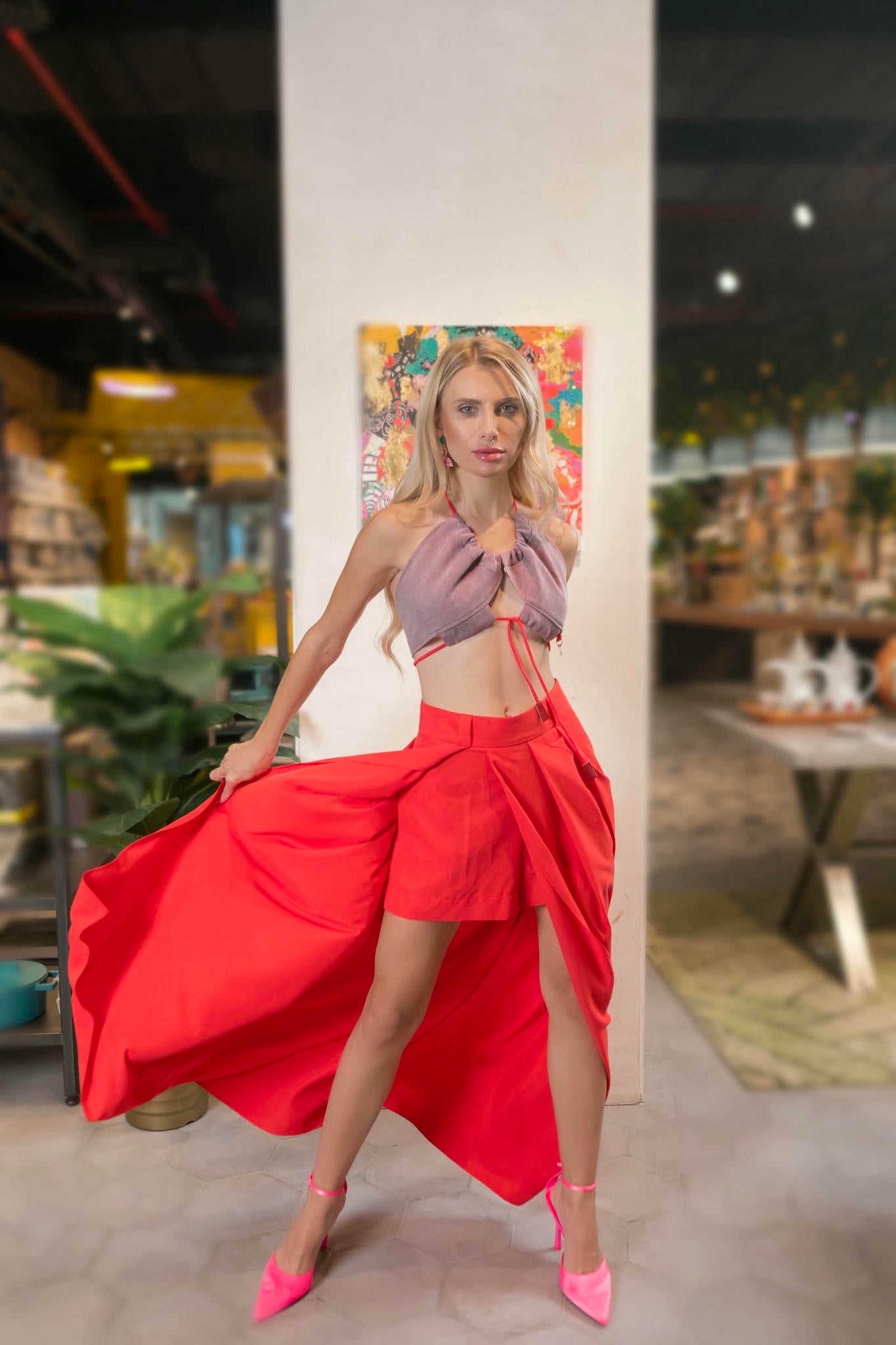 a model wearing a Red Maxi Skirt and Lilac Halter Top Set