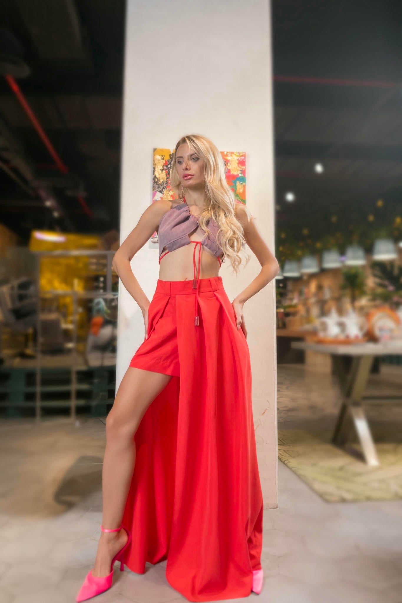 a model wearing a Red Maxi Skirt and Lilac Halter Top Set