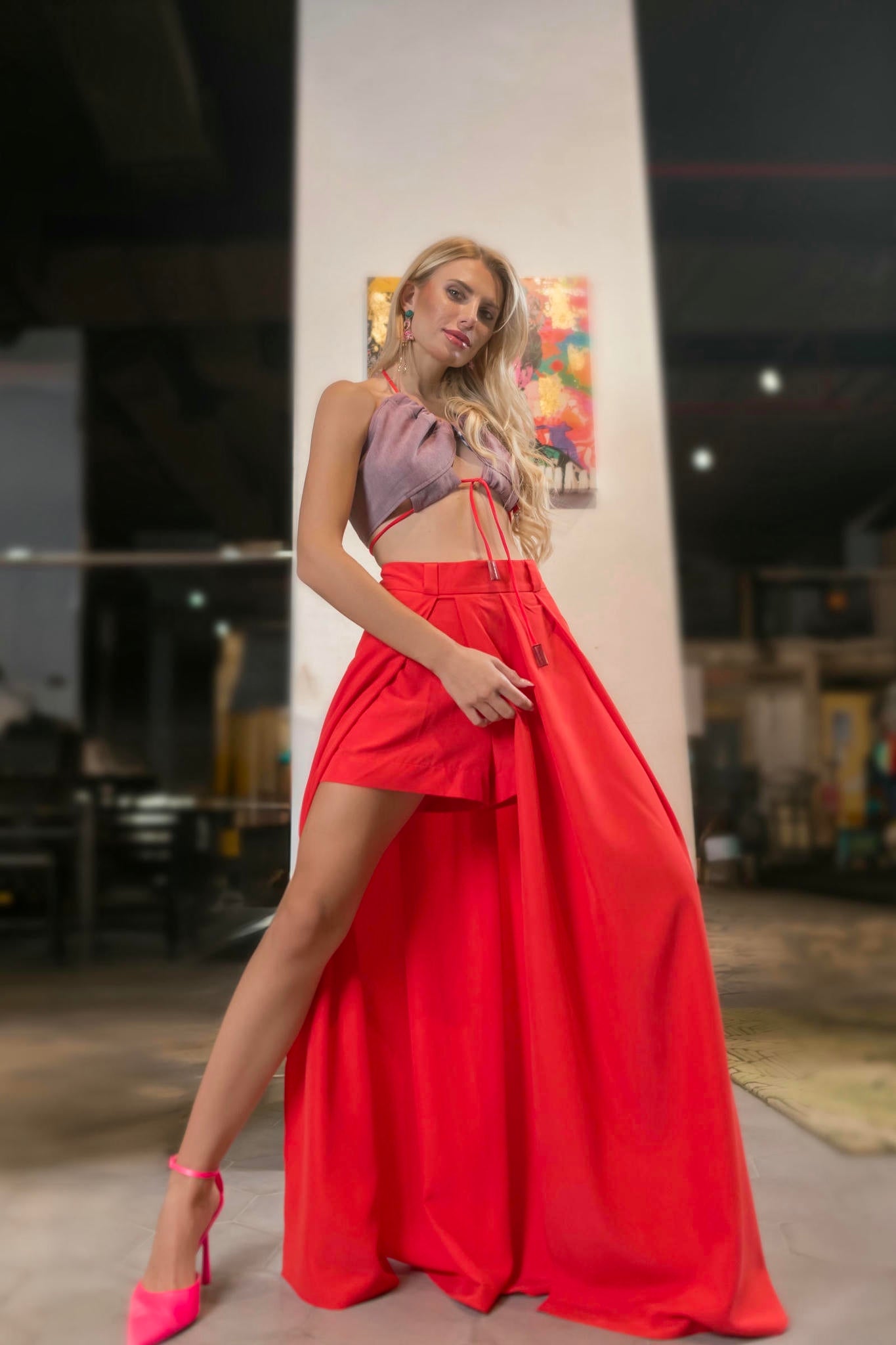 a model wearing a Red Maxi Skirt and Lilac Halter Top Set