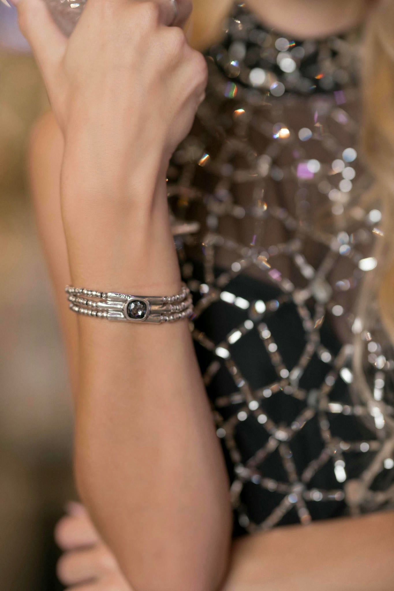 a model wearing a Black Sheer Crystal Two-Piece Set