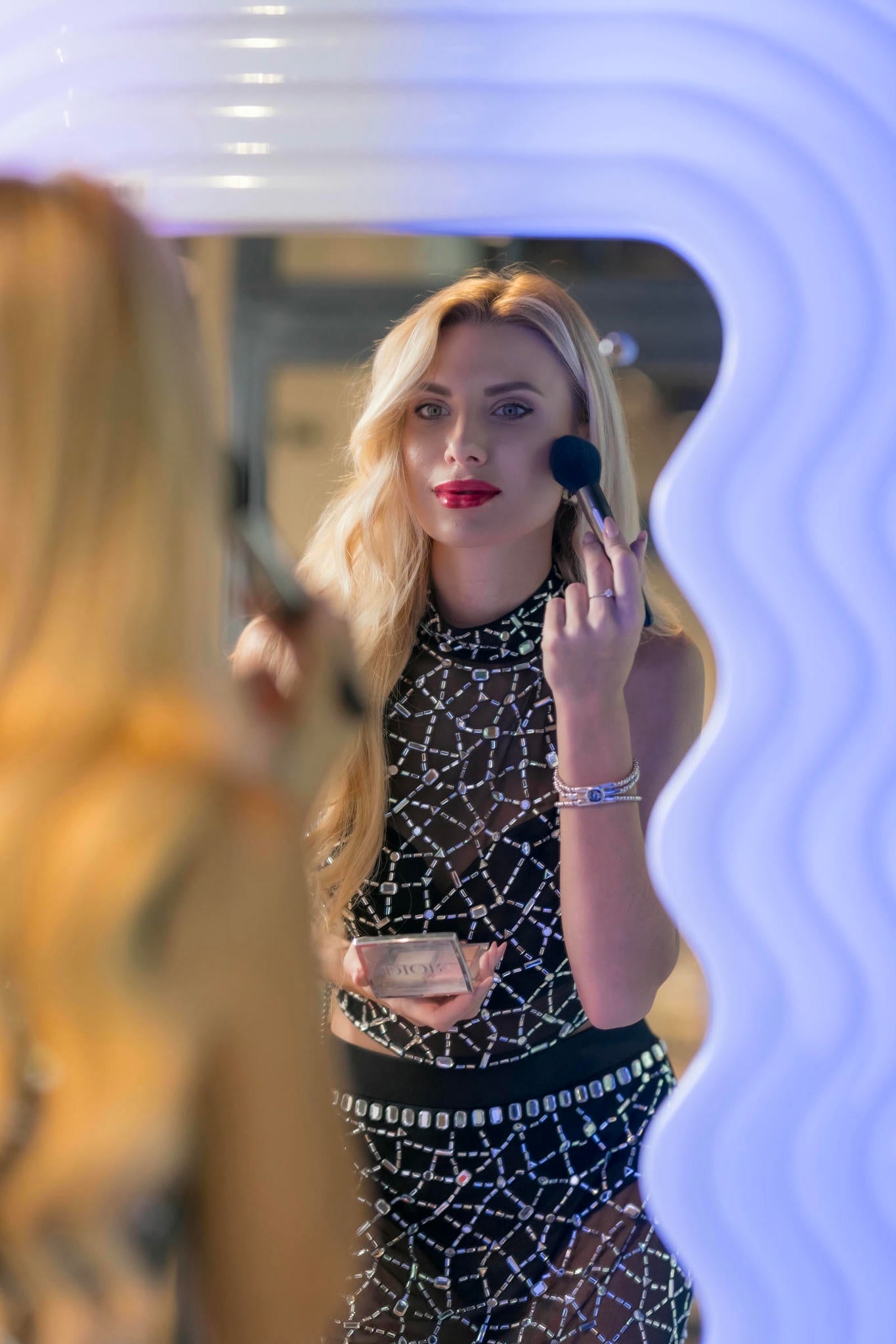 a model wearing a Black Sheer Crystal Two-Piece Set
