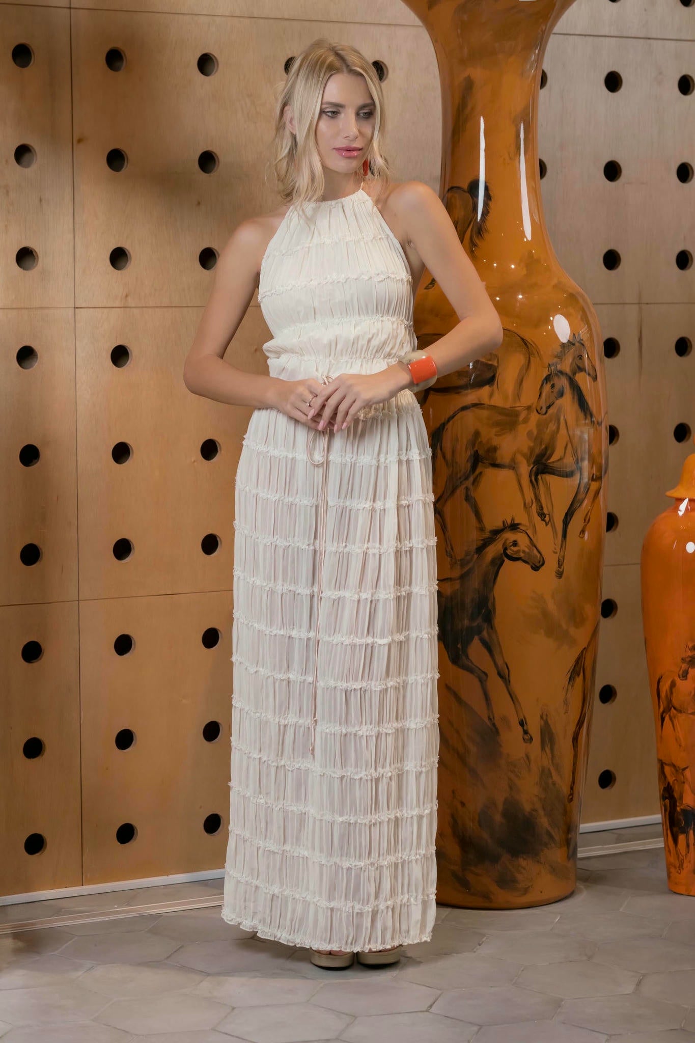 a model wearing an Ivory Halter Top and Maxi Skirt Set