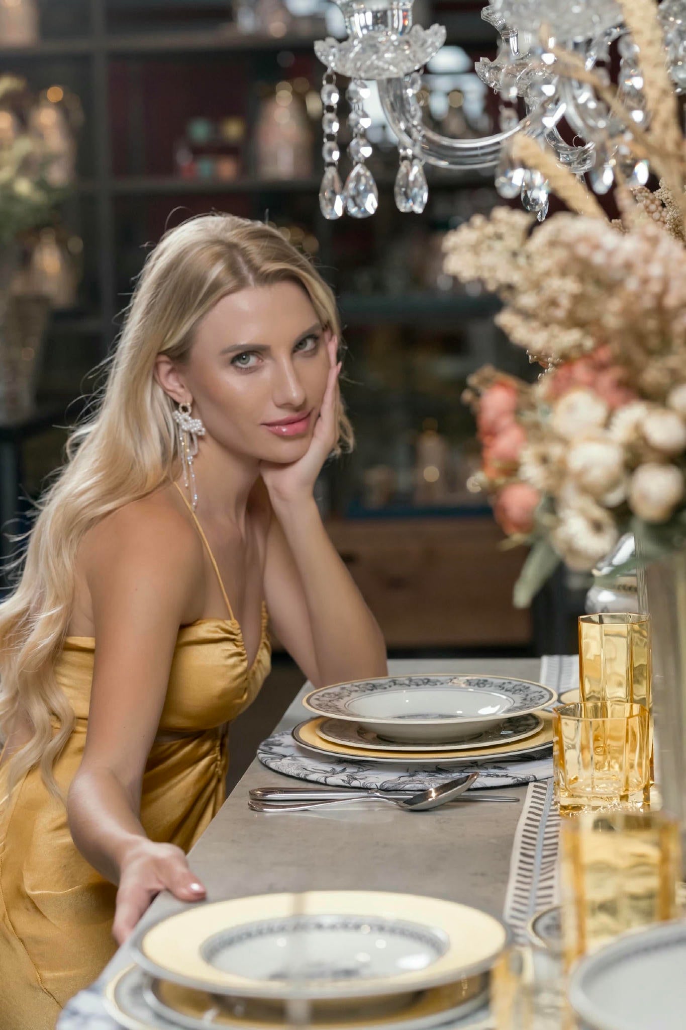 women in gold satin dress