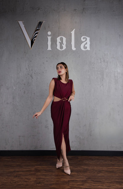 Woman in a burgundy dress standing against a gray wall with 'Viola' branding.