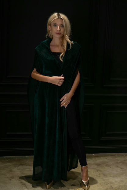 model wearing green cape in casual look