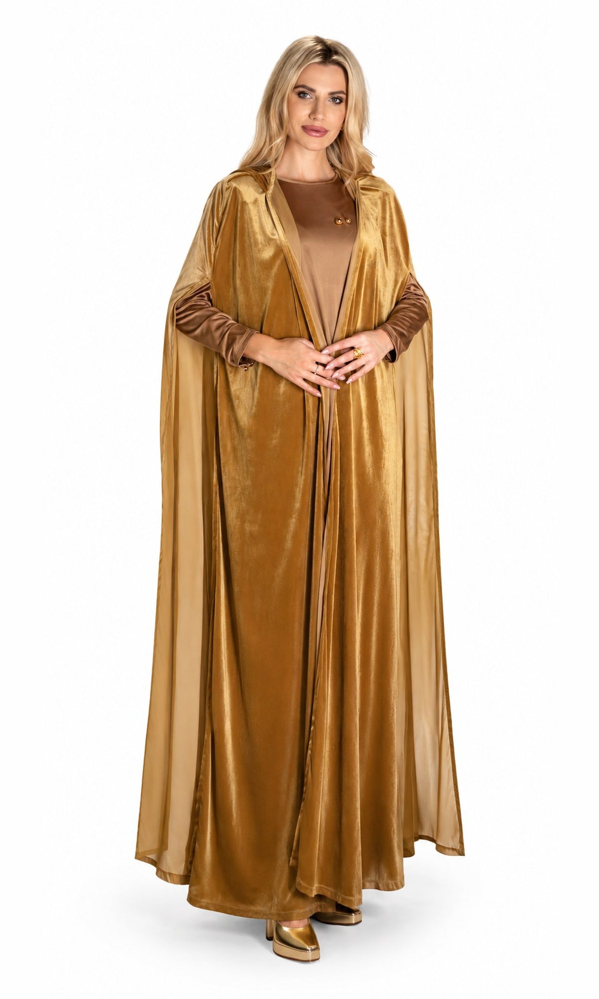 A woman modeling a long, flowing satin-like gold cloak costume over a matching brown top, standing against a plain white studio background.