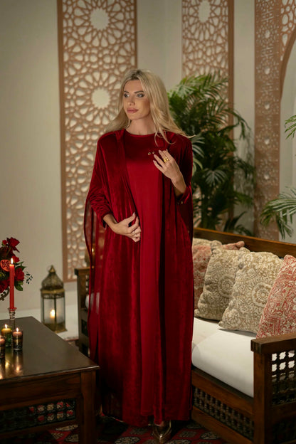 model wearing red dress with cape in Andalusian decor