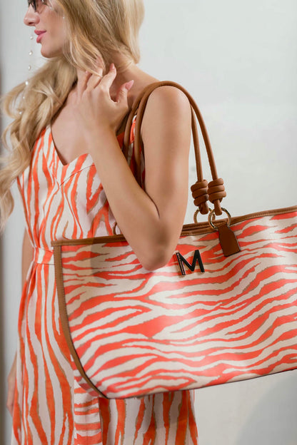 model wearing an Orange and Cream Zebra Maxi Dress
