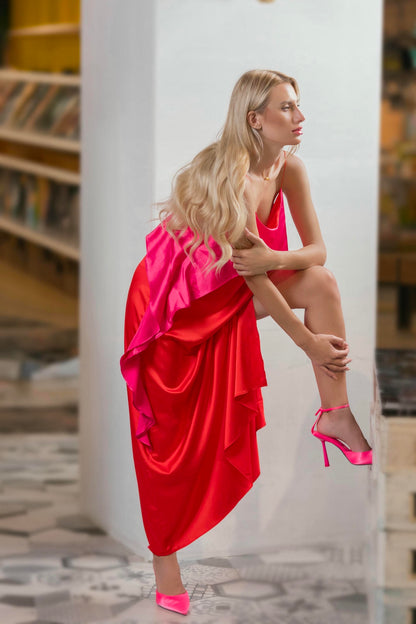 model wearing a Fuchsia and Coral Silk Gown with Ruffled Bodice